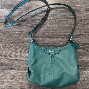 Coach Women’s leather cross body purse